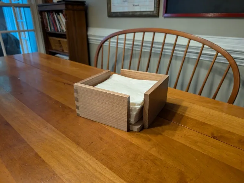 a cherry wood napkin holder