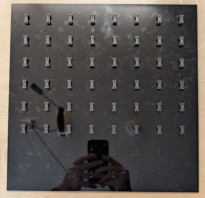 An acrylic panel with mounted NeoPixel Risers