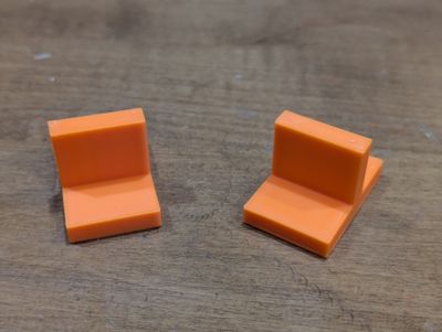 an image of a couple of simple t-shaped quarter inch plastic shims